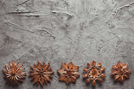 New Year's straw toys, on a gray concrete background. Christmas card. holidayの写真素材