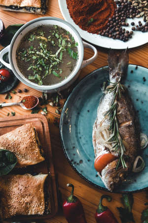 Fresh fish dorado. Dorado and ingredients for cooking on a table. healthy food