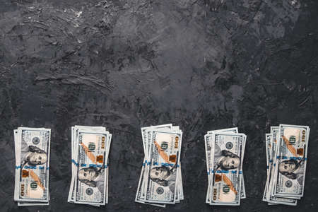 A bundle of money on a dark background. Business concept, salary, opportunities.の写真素材