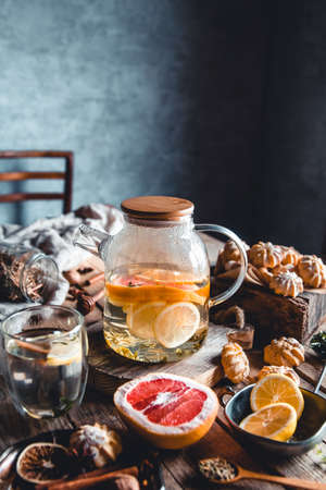 Hot tea with slices of fresh grapefruit on wooden background. Healthy drink, Eco, veganの写真素材