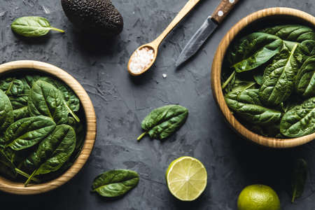 Green food background on stone table top view. Healthy food, vegan, eco products.の写真素材