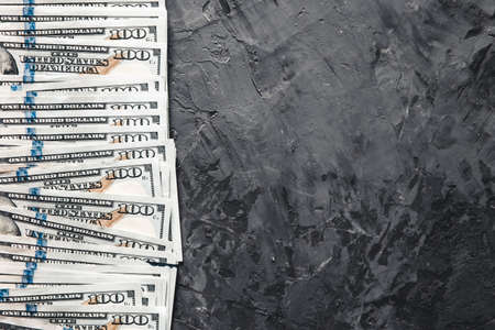 A bundle of money on a dark background. Business concept, salary, opportunities.の写真素材