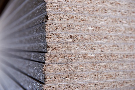 Set in the manufacture of chipboard in low lightの写真素材