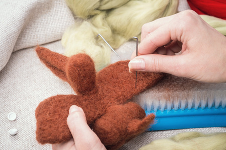 Manufacturing process from wool soft toys. Felting activityの写真素材