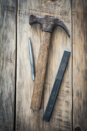 Old construction tools on a wooden table. Top viewの写真素材