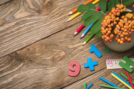 School supplies on a wooden table with space for textの写真素材