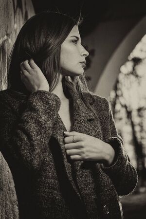 Portrait of a beautiful girl near the wallの写真素材