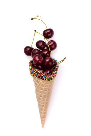 Ripe cherry in a waffle horn isolated on white background. View from aboveの写真素材