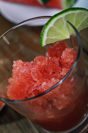 Freshly prepared granite from watermelon and lime on a wooden table, closeupの写真素材