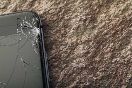 Broken glass on phone screen with copy space, close-upの写真素材