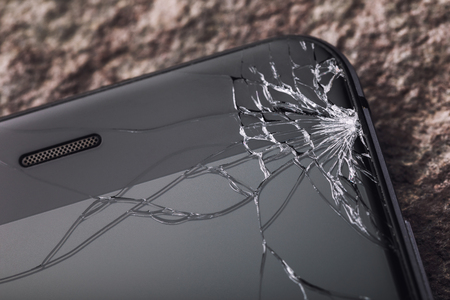 Broken glass on the phone screen, close-upの写真素材