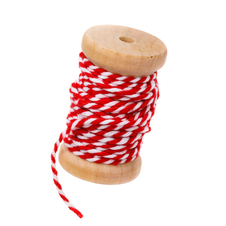 Red thread reel isolated on white background