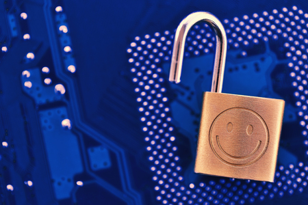 Digital security concept: Open lock on computer chip background with copy space