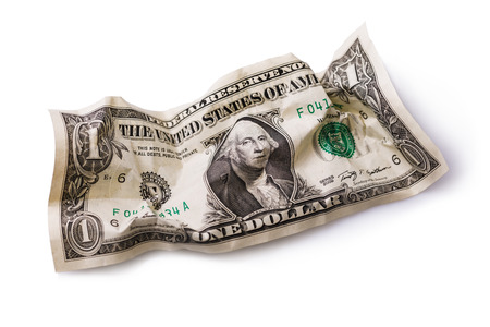 Crumpled dollar isolated on white backgroundの写真素材