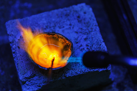 Melting of gold in crucible, close-up. Workflow in a jewelry workshopの写真素材