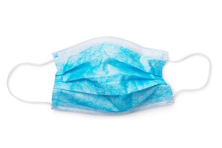 Blue medical mask isolated on white background. Bacteria protectionの写真素材