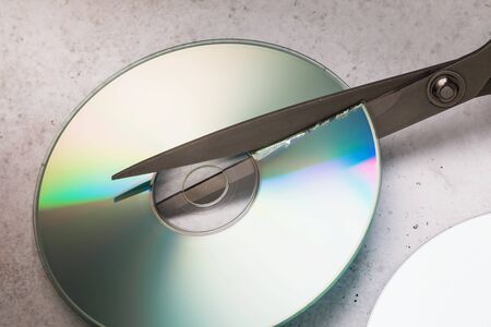 Scissors cut cd. Information destruction conceptの写真素材