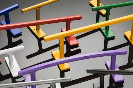 Metal railing of various shapes and colors for fingerboards. Background from sports equipmentの写真素材