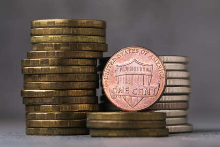 One cent on a background of coins close upの写真素材