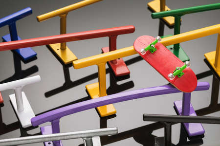 Fingerboard on metal railings of various shapes and colors. Background from sports equipmentの写真素材