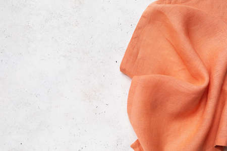 Orange napkin on the right side of the abstract background with copy space, food background