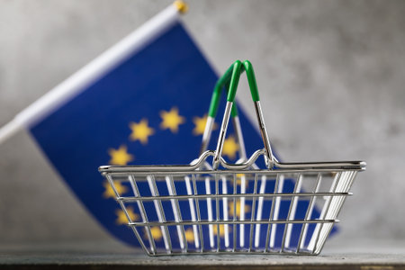 Empty grocery basket on the background of the EU flag, food crisis conceptの写真素材