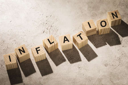 Wooden cubes with text on the table, concept on the topic of inflationの写真素材