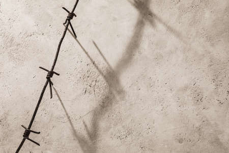 Rusty barbed wire on an abstract background with copy spaceの写真素材