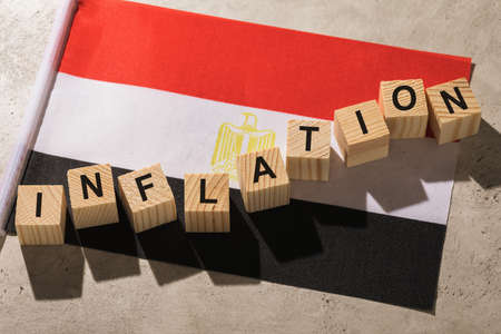 Egyptian flag and wooden cubes with text, concept on the theme of inflation in Egyptの写真素材