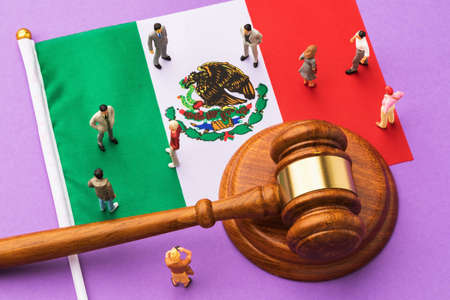 Judge gavel, Mexico flag and plastic toy men on colored background, Mexican society litigation conceptの写真素材