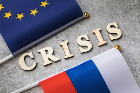Text from wooden letters and two flags, the concept of a crisis in relations between Russia and the European Unionの写真素材