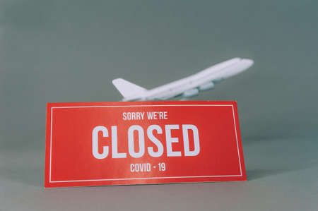 Red plate Sorry We're Closed COVID-19 with airplaneの写真素材