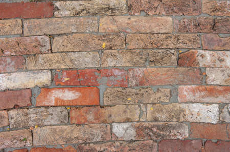 Simple texture of an old multi-colored brick