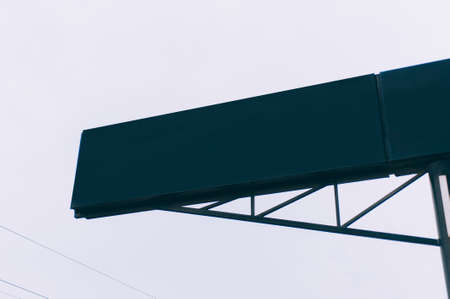 Shield and pointer for navigation on a background of the skyの写真素材