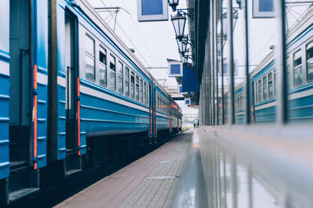 Passenger train on the platform of the railway stationの写真素材