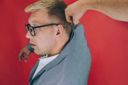 The businessman was hung on a clothes rackの写真素材
