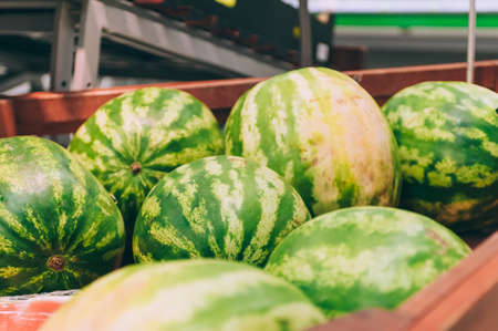 A box of fresh watermelon in a supermarketの写真素材