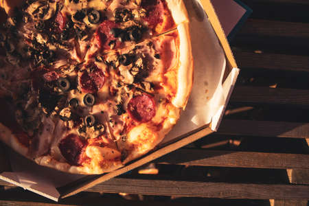 Pizza in a box close up. Fast food in the fresh airの写真素材
