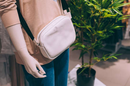 Women's bag on a manikin in a supermarketの写真素材