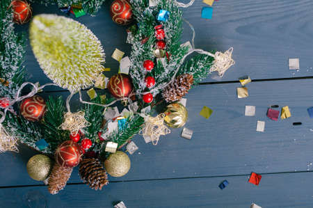 Festive composition for new year and christmas. Christmas tree with decoration on a wooden tableの写真素材