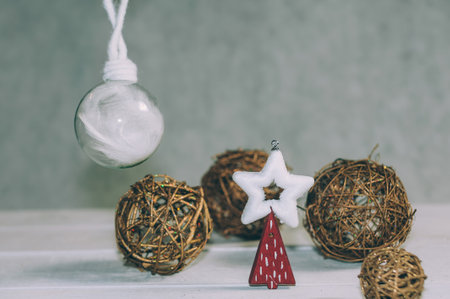 Festive composition for new year and christmas. Christmas tree with decoration on a wooden tableの写真素材