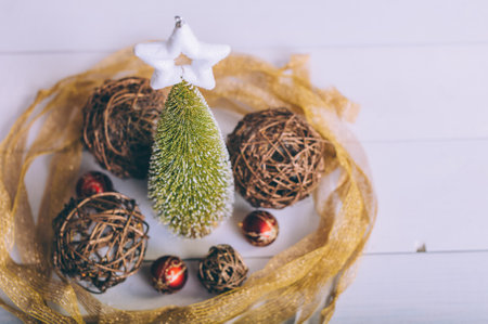 Festive composition for new year and christmas. Christmas tree with decoration on a wooden tableの写真素材