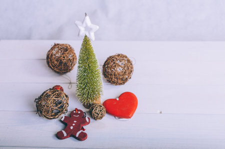 Festive composition for new year and christmas. Christmas tree with decoration on a wooden tableの写真素材