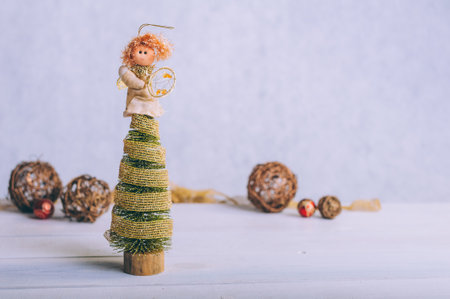 Festive composition for new year and christmas. Christmas tree with decoration on a wooden tableの写真素材