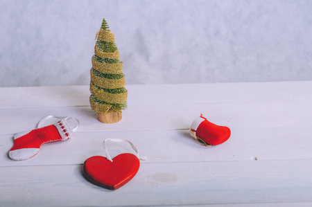 Festive composition for new year and christmas. Christmas tree with decoration on a wooden tableの写真素材