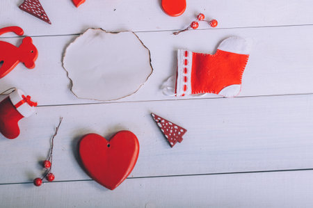 Burnt paper mockup with holiday decoration for the new year on a wooden backgroundの写真素材