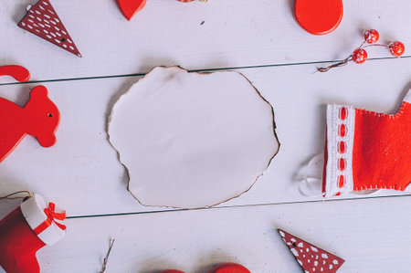 Burnt paper mockup with holiday decoration for the new year on a wooden backgroundの写真素材