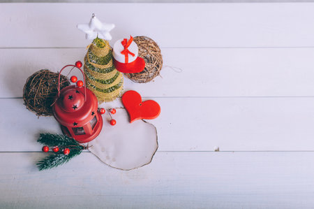 Festive composition for new year and christmas. Christmas tree with decoration on a wooden tableの写真素材