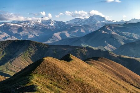 Remote highlands landscape with mountain peaks in the distance in Dagestan Russiaの写真素材
