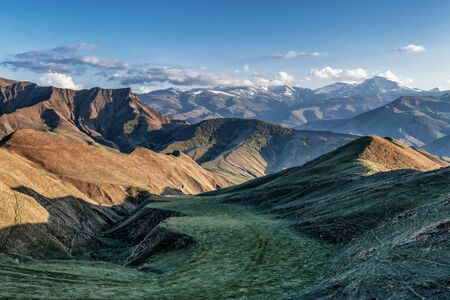 Remote highlands landscape with mountain peaks in the distance in Dagestan Russiaの写真素材